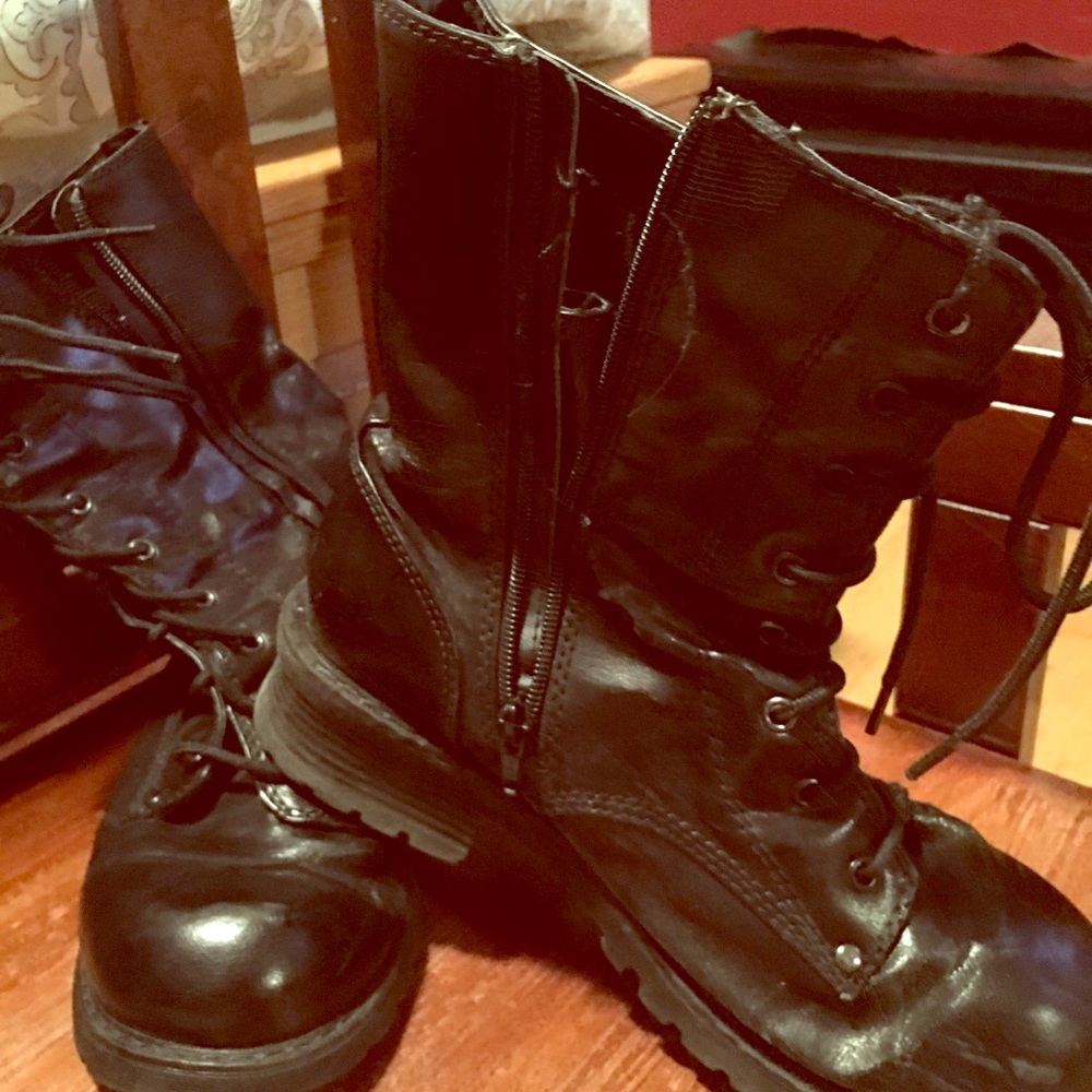 Slightly worn combat style boots.